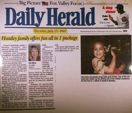 Front page of the Daily Herald from July 27, 1999, featuring a smiling girl holding a cat.