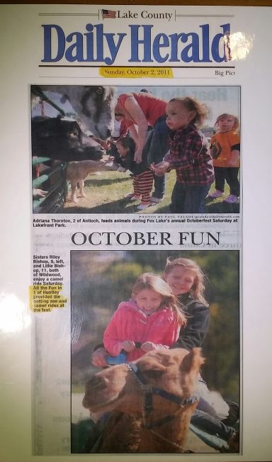 Front page of the Daily Herald featuring children enjoying outdoor activities.