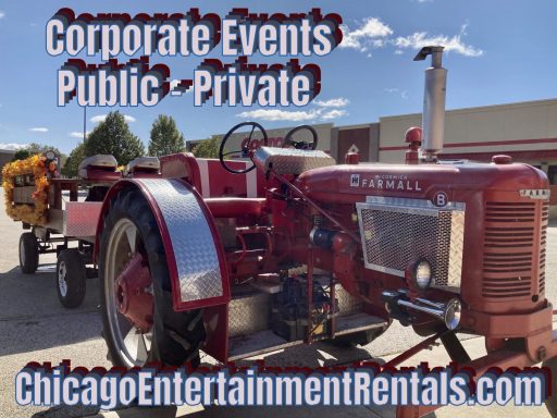 Red vintage tractor parked outside with advertising for event rentals.